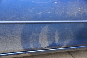 It is quite clear that the car wash was misaligned. This looks like the marks from the wheel brush - on the door!