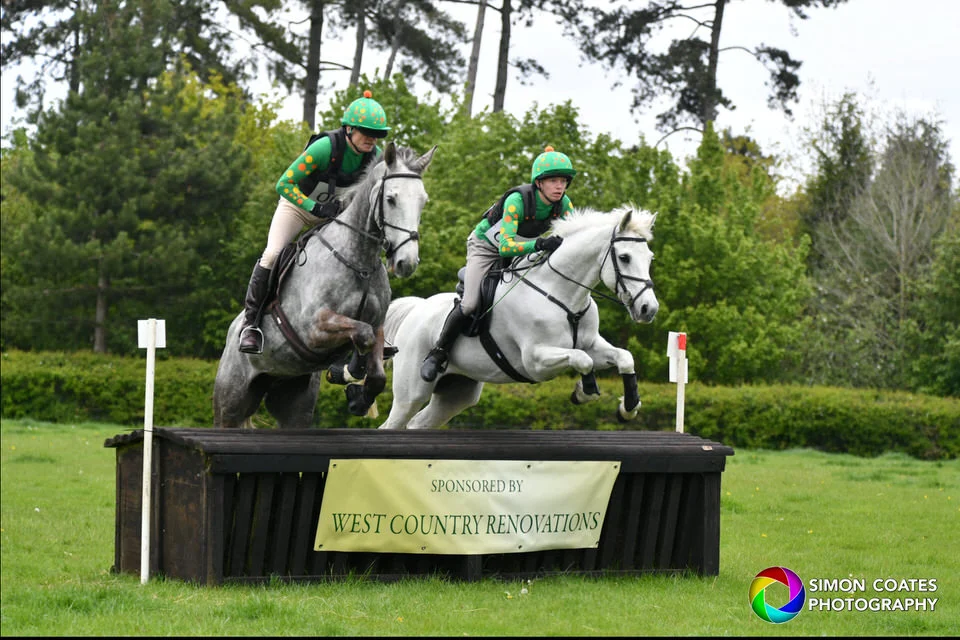 A pair of horses jumping fence 19 at Bignall
